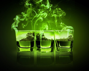 Three glasses of green absinth