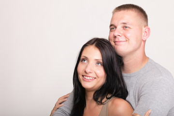 young in love happy smiling couple isolated