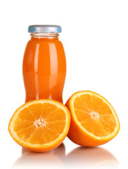 Delicious orange juice in a bottle and orange next to it