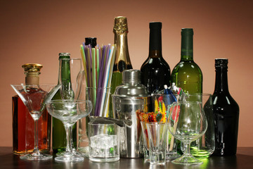 Collection of various glasses and drinks on color background