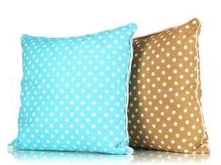 Blue and brown bright pillows isolated on white