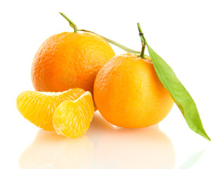 Ripe sweet tangerine with leaves, isolated on white