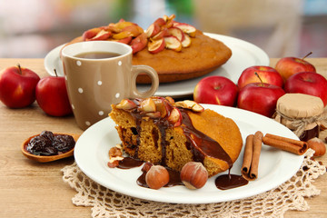 slice of tasty homemade pie with chocolate and apples and cup