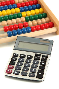 Bright wooden toy abacus and calculator, isolated on white