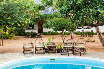 Chairs on swimming pool border