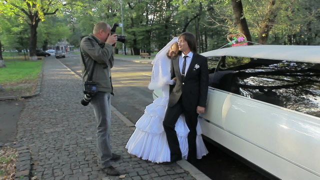 young marrying couple . Photographing process in city. wedding