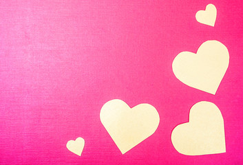 Orange heart on a pink background