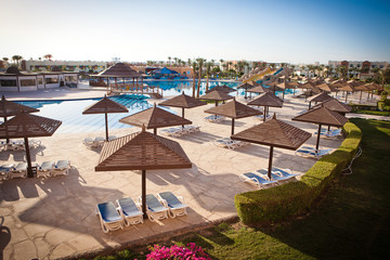 Obraz premium Sunloungers at the swimming pool