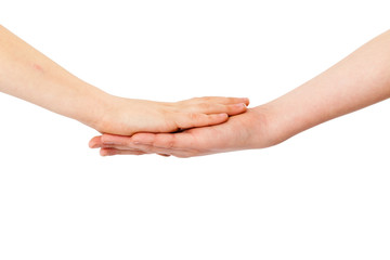 Two kids' hands lying on each other, isolated white