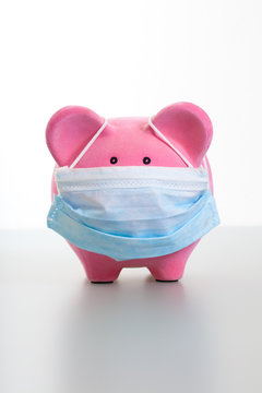 Piggy Bank With Face Mask - Swine Flu Concept