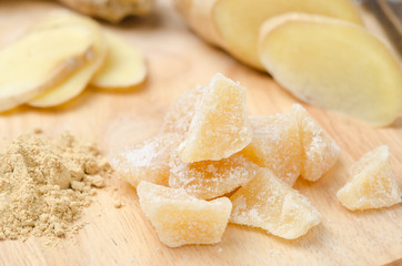 candied ginger on a wooden board closeup