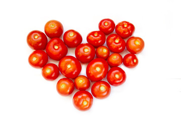 Fresh tomatoes stacked in the form of heart