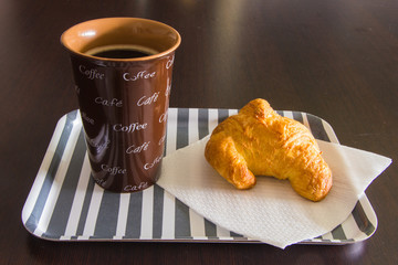 Breakfast with coffee and croissant