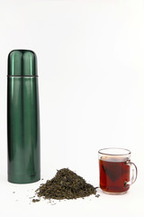 Vacuum flask and tea on the white background