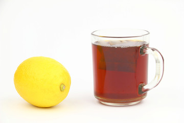 Cup of tea and lemon on the white background
