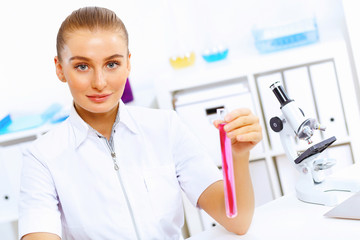 Young female scientist working in laboratory