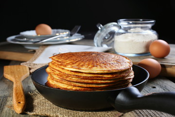 Oatmeal pancakes in a frying pan.
