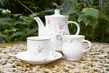 Tea for Two in the Garden on Golden Decoration Table