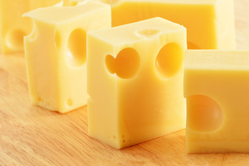 Fresh cheese on breadboard