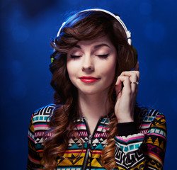 Girl with headphones enjoying music