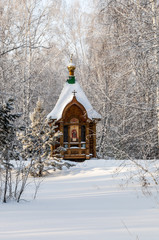 old orthodox church in winter forest