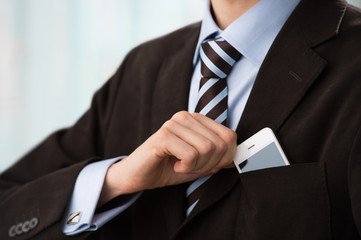 Closeup of torso of confident business man wearing elegant suit