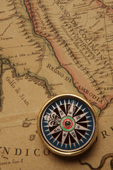 Vintage compass and old map