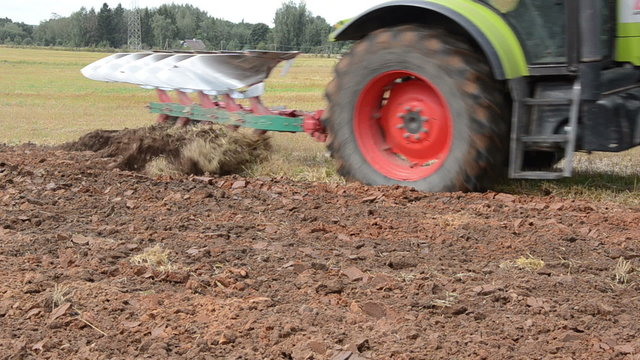 tractor closeup plow field rural farm building house