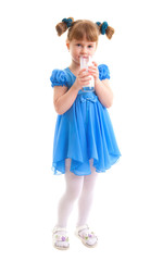 Smiling girl with a glass of milk