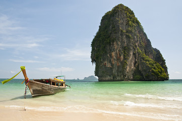 Long tail boat and limestone rock in the Andaman Sea - Thailand