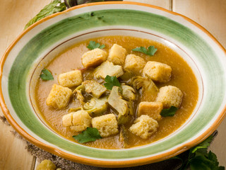 artichoke soup with toasted sliced bread, vegetarian food