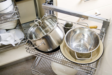 Pile of pots and pans in the cupboard