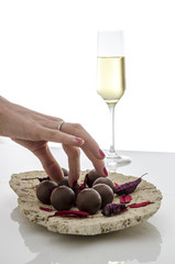 Female hand taking a chocolate candy