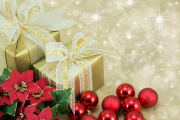 Gold gifts with red bauble and flower decorations.