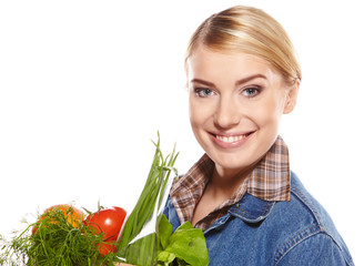 Woman with a shopping bag filled with nutritious fruit and veget