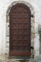 Fototapeta premium Old dark wooden texture with medieval white plaster wall around