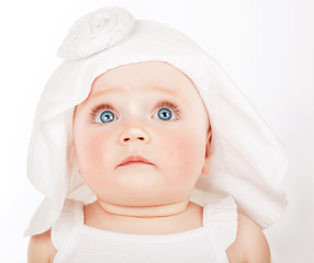 scared little child in white hat