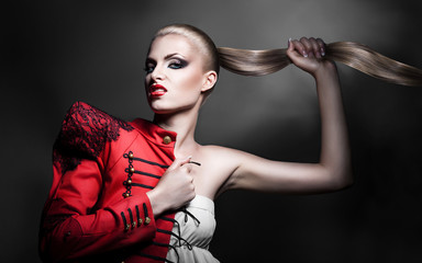 sexy blonde woman in red jacket with red lips and long tail