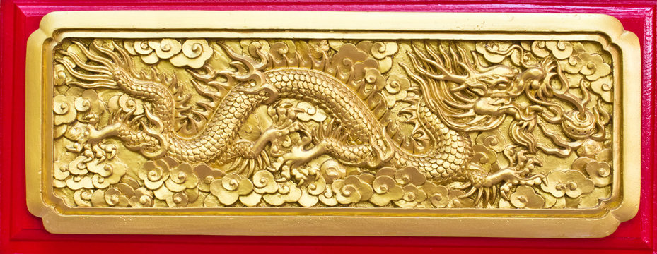 Golden dragon(Chinese: Long) wood carving in Red background