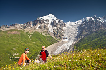 Fototapeta na wymiar Hiker take a rest during hiking in Caucasus mountains, Georgia