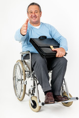 Obraz premium Friendly man in wheelchair holding thumbs up