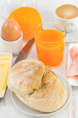 bread with ham, cheese, orange and juice