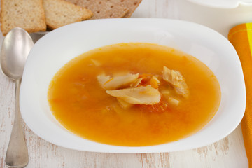 soup with codfish on the white plate