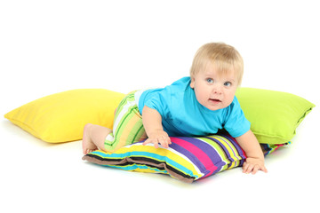 Little boy and color pillows, isolated on white