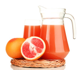 Full glass and jug of grapefruit juice and grapefruits isolated