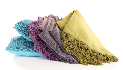 Colorful pillows and plaids isolated on white