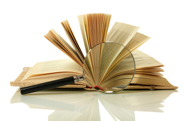 Magnifying glass and open book isolated on white