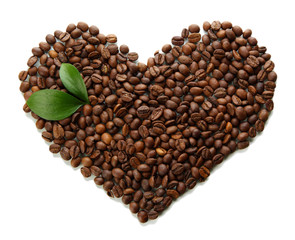 Coffee beans with leaves isolated on white