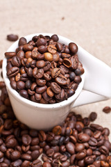cup of coffee on a background coffee beans