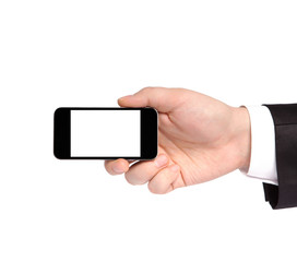 hand of a businessman in a suit holding a phone with isolated di